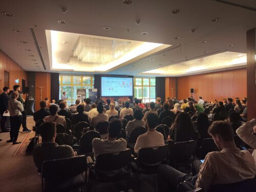 A room full of people following a talk at the Catalysis Conference
